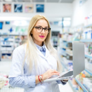 young woman pharmacist using laptop