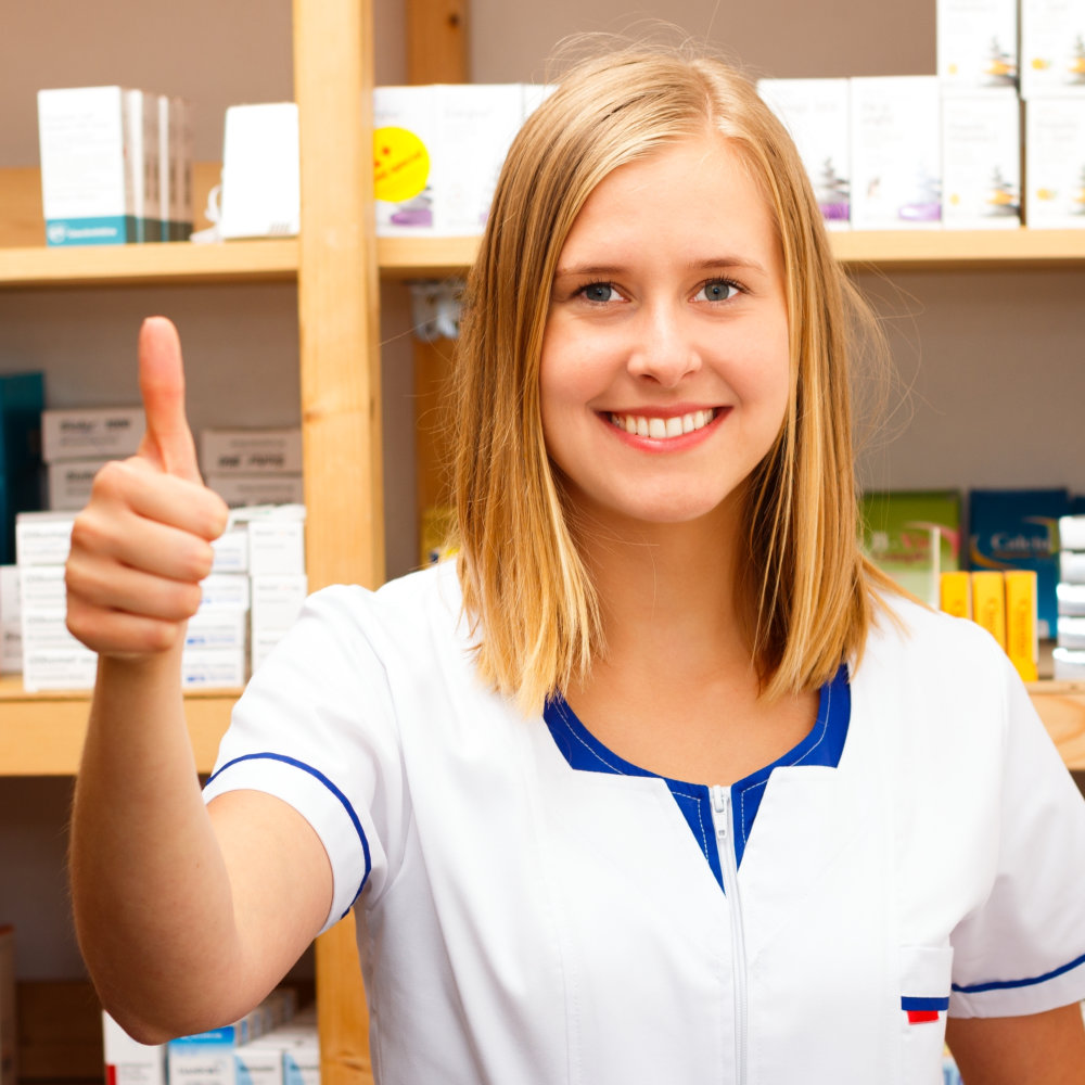 young pharmacist thumbs up