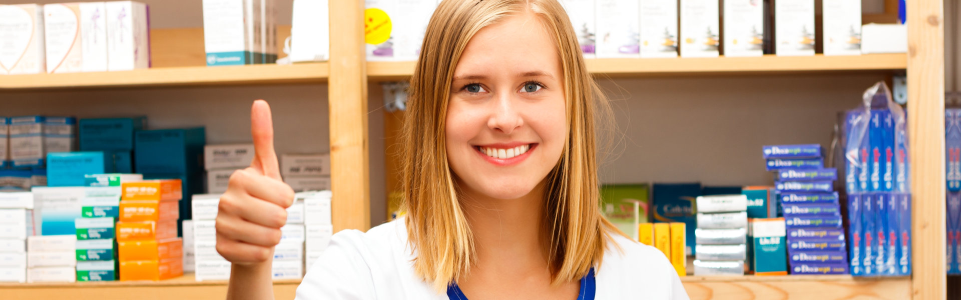 young pharmacist thumbs up